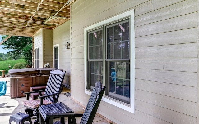 view of patio / terrace featuring a hot tub