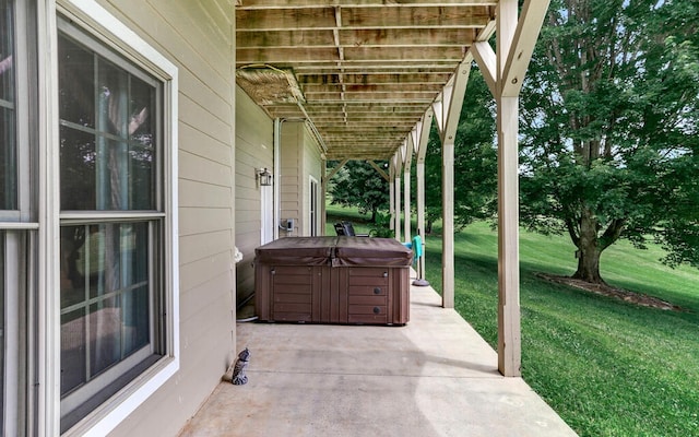 view of patio / terrace with a hot tub