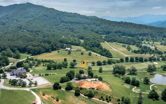 bird's eye view with a water and mountain view