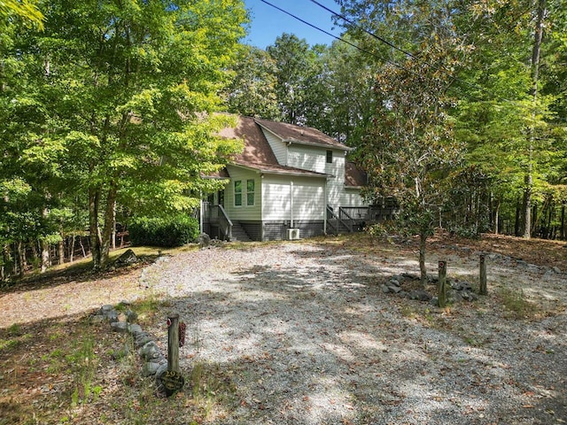 exterior space with gravel driveway