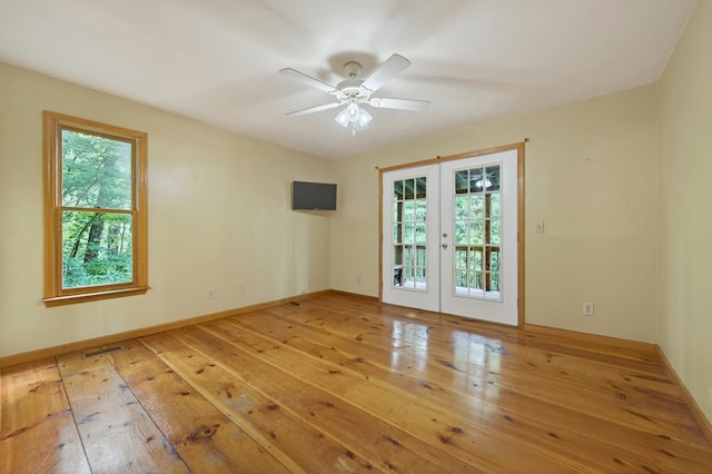 776 Mountain Oak Rd, Ellijay, GA 30536 - empty room featuring french doors, wood-type flooring, and a ceiling fan