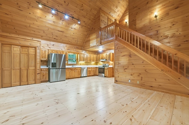 776 Mountain Oak Rd, Ellijay, GA 30536 - kitchen featuring stainless steel appliances, high vaulted ceiling, wooden walls, light countertops, and light wood-style flooring