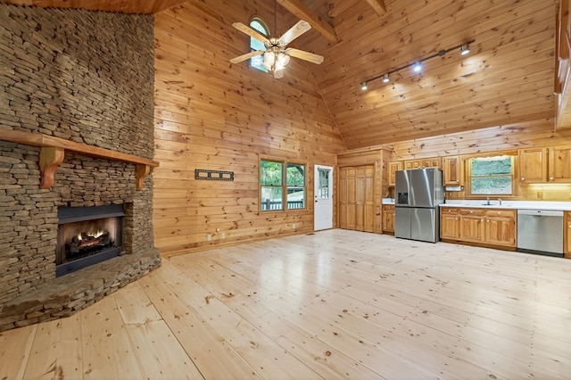 776 Mountain Oak Rd, Ellijay, GA 30536 - kitchen with stainless steel appliances, high vaulted ceiling, light wood finished floors, wooden walls, and wooden ceiling