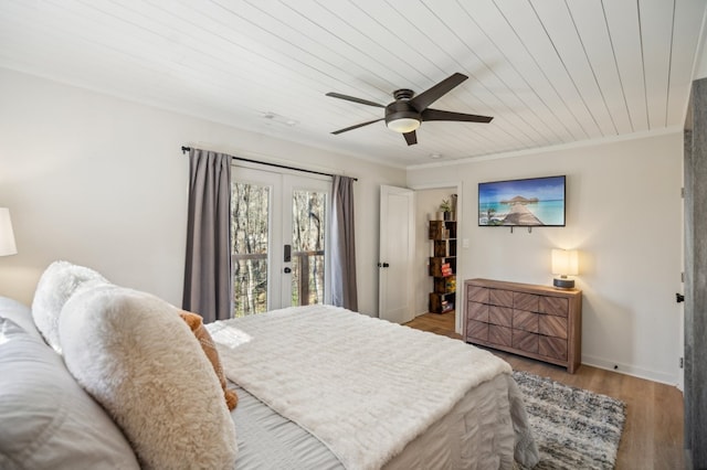 bedroom featuring ornamental molding, ceiling fan, wood finished floors, access to outside, and wooden ceiling