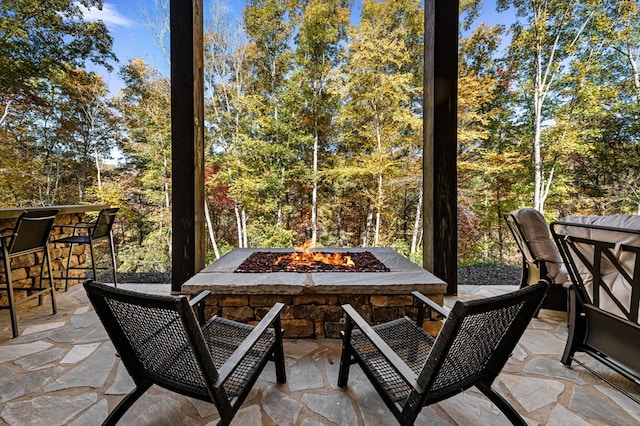 view of patio with an outdoor fire pit