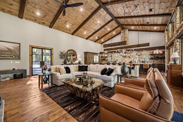 living room with hardwood / wood-style floors, high vaulted ceiling, and wooden ceiling