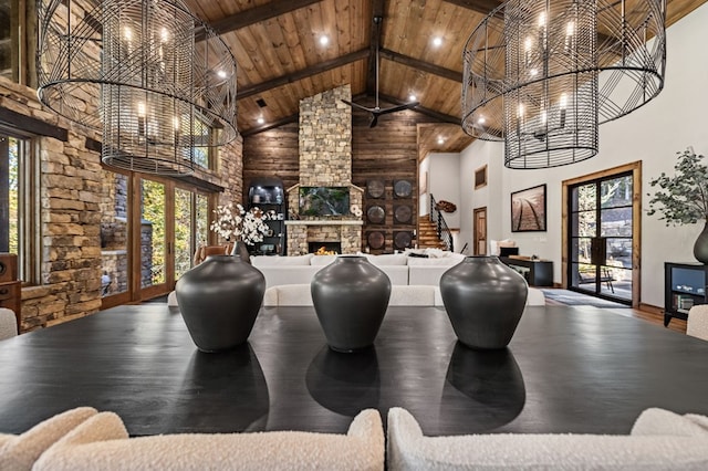 game room with beam ceiling, a stone fireplace, high vaulted ceiling, wood ceiling, and hardwood / wood-style flooring