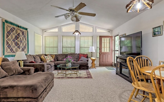 carpeted living room featuring vaulted ceiling and ceiling fan