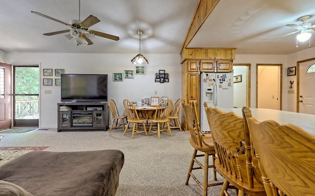 dining room featuring light colored carpet and ceiling fan