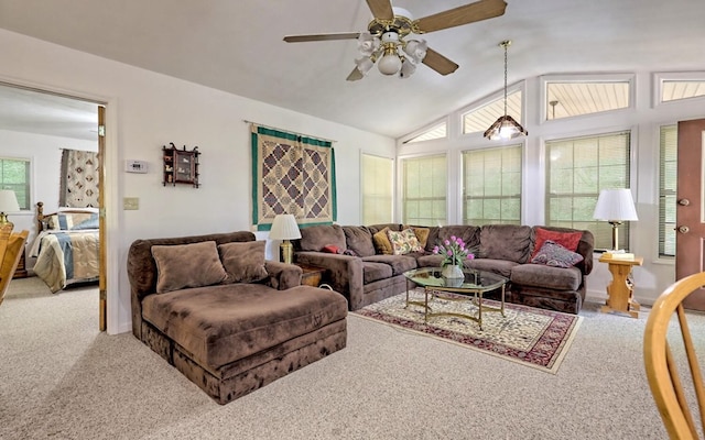 living room with carpet, ceiling fan, and lofted ceiling