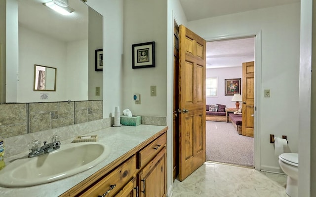 bathroom with vanity and toilet