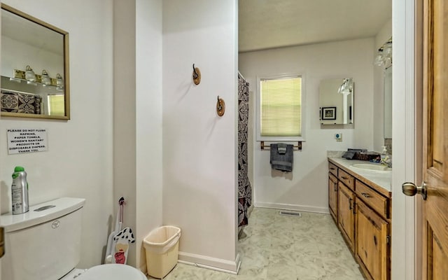 bathroom with vanity and toilet