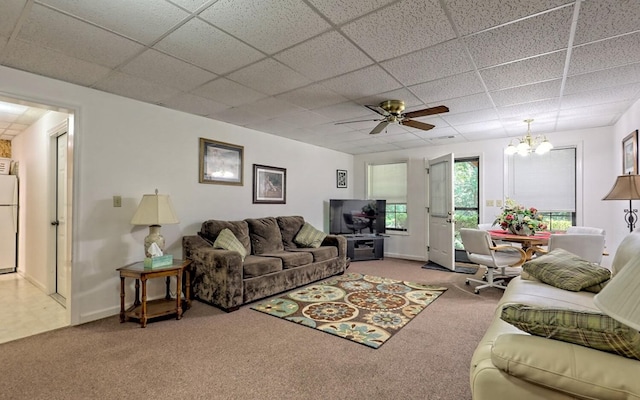 living room with carpet and a drop ceiling