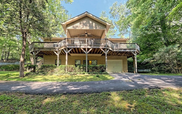 view of front of property with a garage and a wooden deck