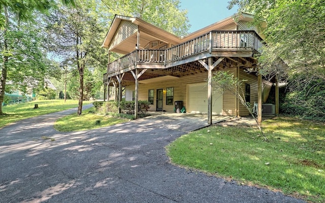 view of front facade featuring central AC, a garage, a front lawn, and a deck