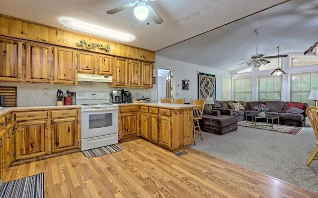 kitchen with kitchen peninsula, vaulted ceiling, white range with electric stovetop, ceiling fan, and light hardwood / wood-style floors