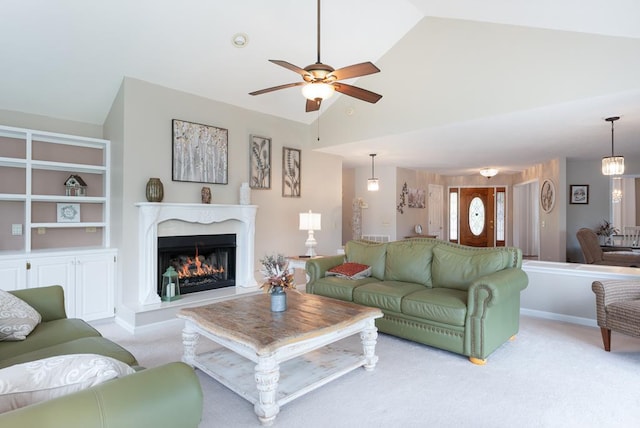 1537 Victoria Woods Dr, Hiawassee, GA 30546 - carpeted living room with vaulted ceiling, ceiling fan, and a high end fireplace