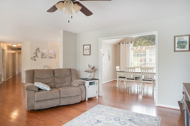1537 Victoria Woods Dr, Hiawassee, GA 30546 - living area featuring ceiling fan, wood finished floors, baseboards, and a chandelier
