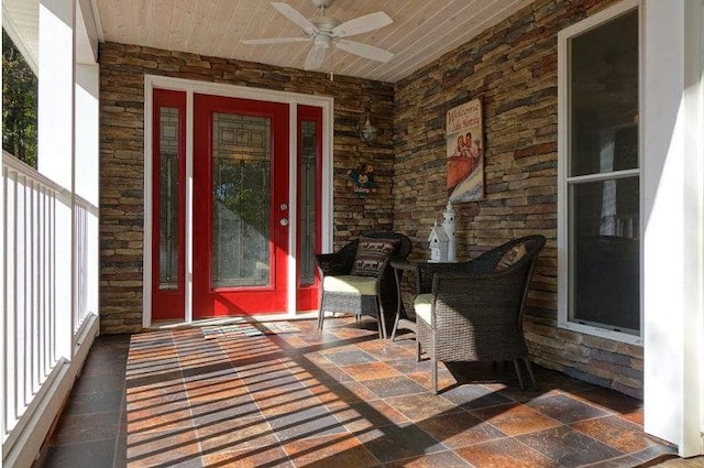 property entrance with covered porch and a ceiling fan