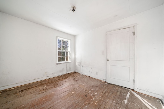 spare room with hardwood / wood-style flooring