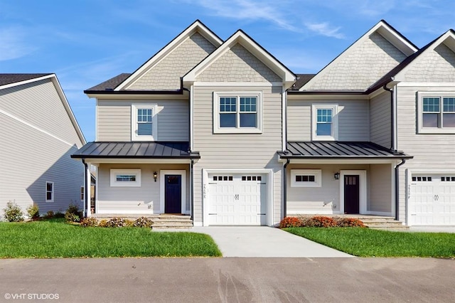 view of front of home featuring a garage and a front yard