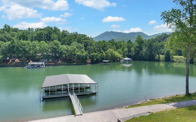 dock area featuring a water and mountain view