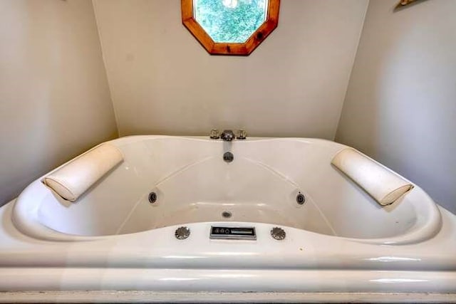 bathroom featuring a tub to relax in