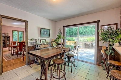 dining space featuring light tile patterned flooring