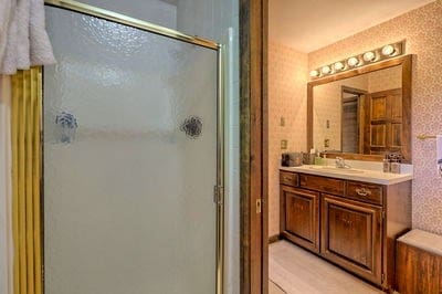 bathroom featuring vanity and walk in shower