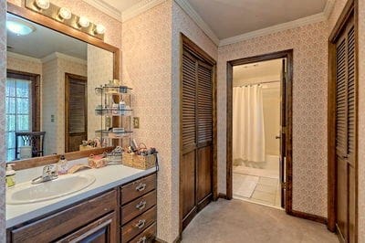 bathroom featuring vanity and crown molding