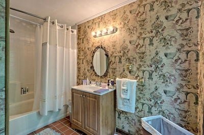 bathroom with crown molding, tile patterned flooring, vanity, and shower / bath combo