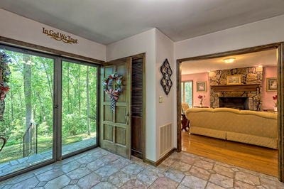 interior space with plenty of natural light, light hardwood / wood-style floors, and a fireplace