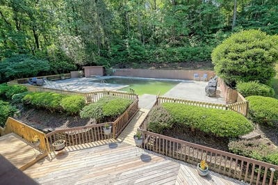 view of property's community featuring a swimming pool side deck and a patio