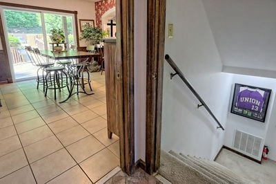 stairs featuring tile patterned floors