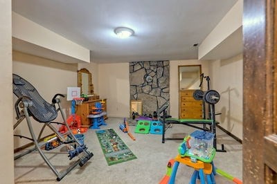 game room featuring light colored carpet