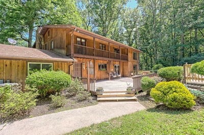 view of front of property with a balcony and a deck