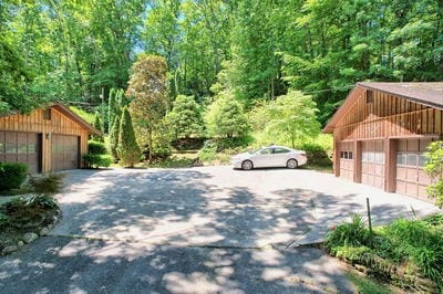 view of side of property featuring an outbuilding and a garage