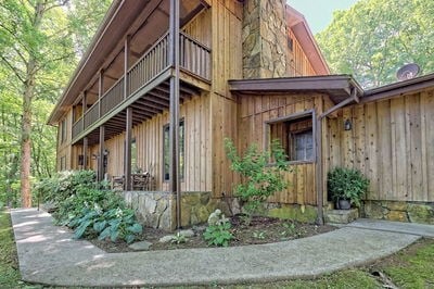 view of side of home with a balcony