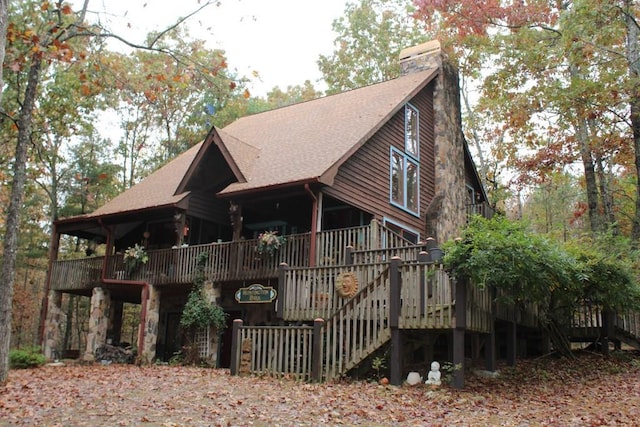 601 Sierra Cir, Murphy, NC 28906 - view of front of home featuring a chimney, a wooden deck, a shingled roof, and stairway