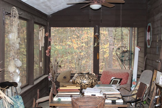 sunroom featuring ceiling fan and vaulted ceiling