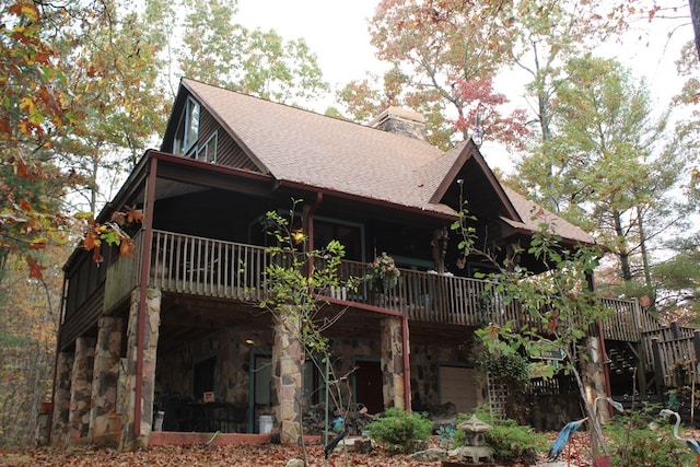 rear view of house with a balcony