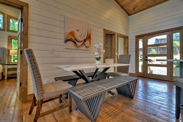 sunroom with lofted ceiling and wood ceiling