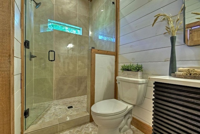 bathroom with a shower with door, wooden walls, and toilet