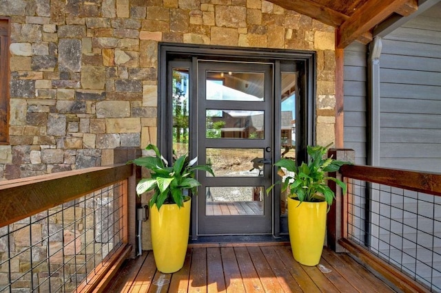 doorway to property featuring a balcony