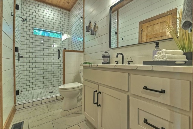 bathroom with vanity, toilet, wooden walls, and walk in shower