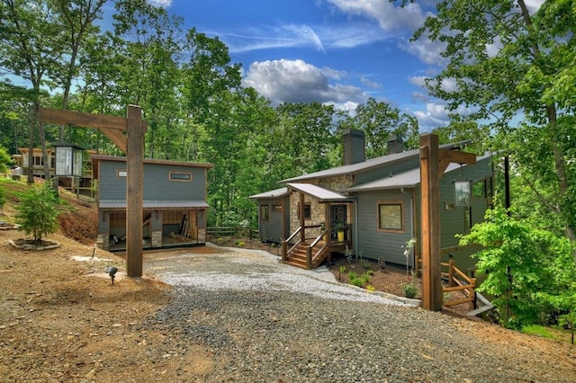 view of front of house with a storage shed