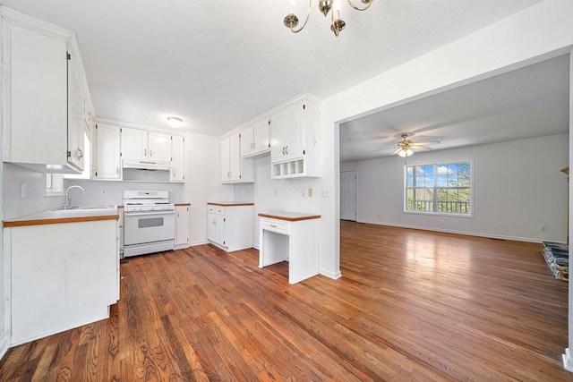 kitchen with white range with gas cooktop, ceiling fan, under cabinet range hood, white cabinetry, and a sink