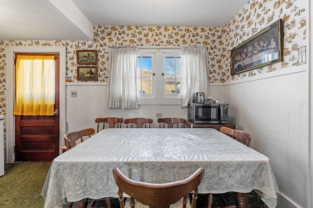134 Church St, Copperhill, TN 37317 - carpeted dining space with tile walls