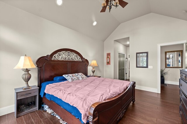 bedroom featuring ceiling fan, a closet, vaulted ceiling, and dark hardwood / wood-style floors