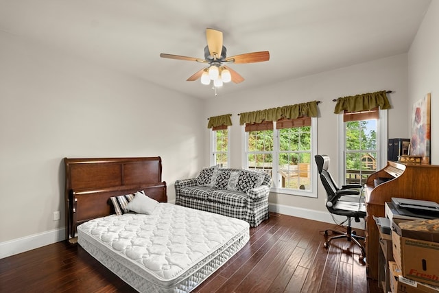 bedroom featuring ceiling fan and dark wood-type flooring